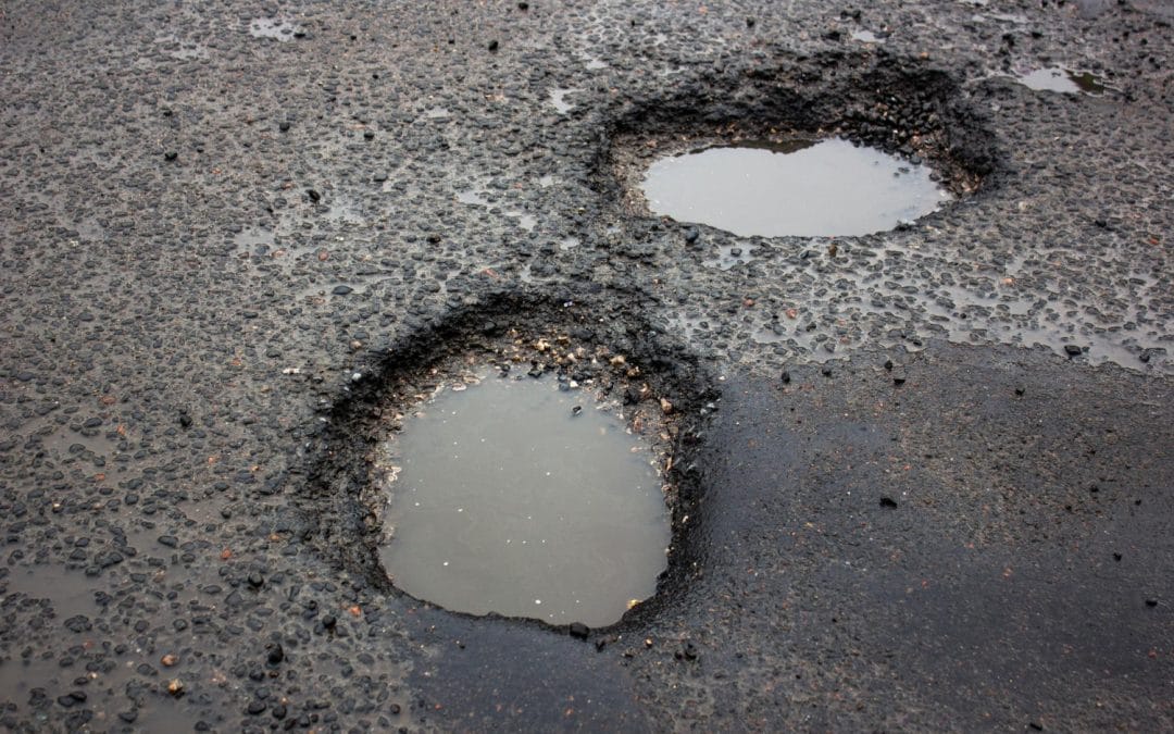 7 Common Causes of Asphalt Potholes & How to Prevent Them